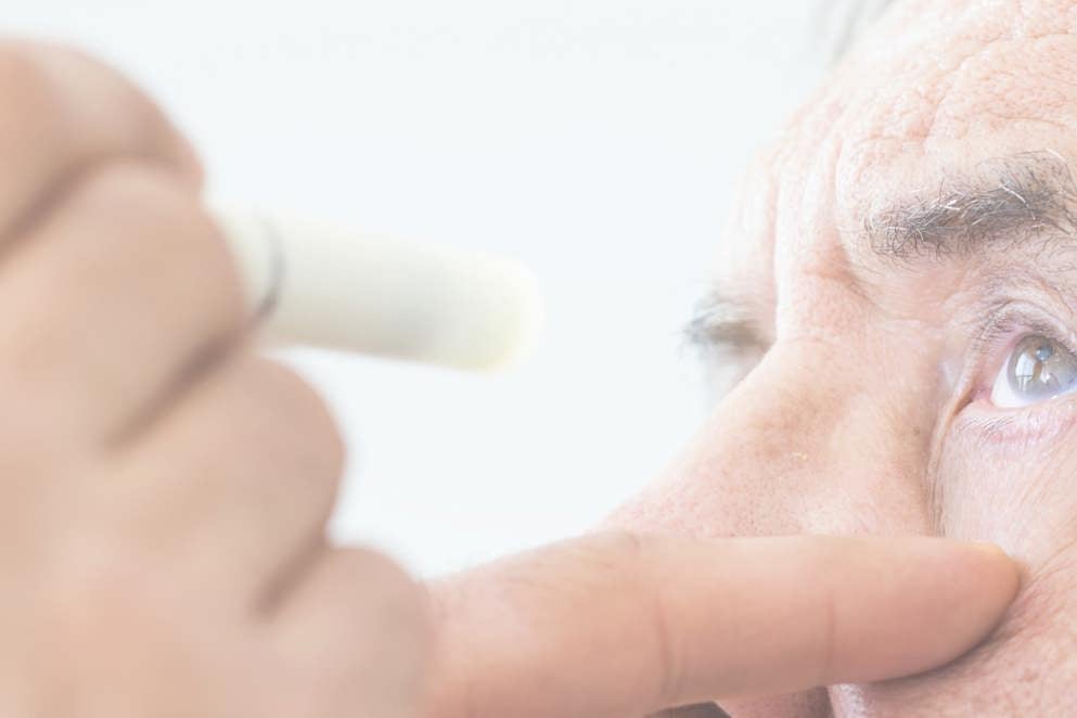 Elderly man examined by an ophthalmologist