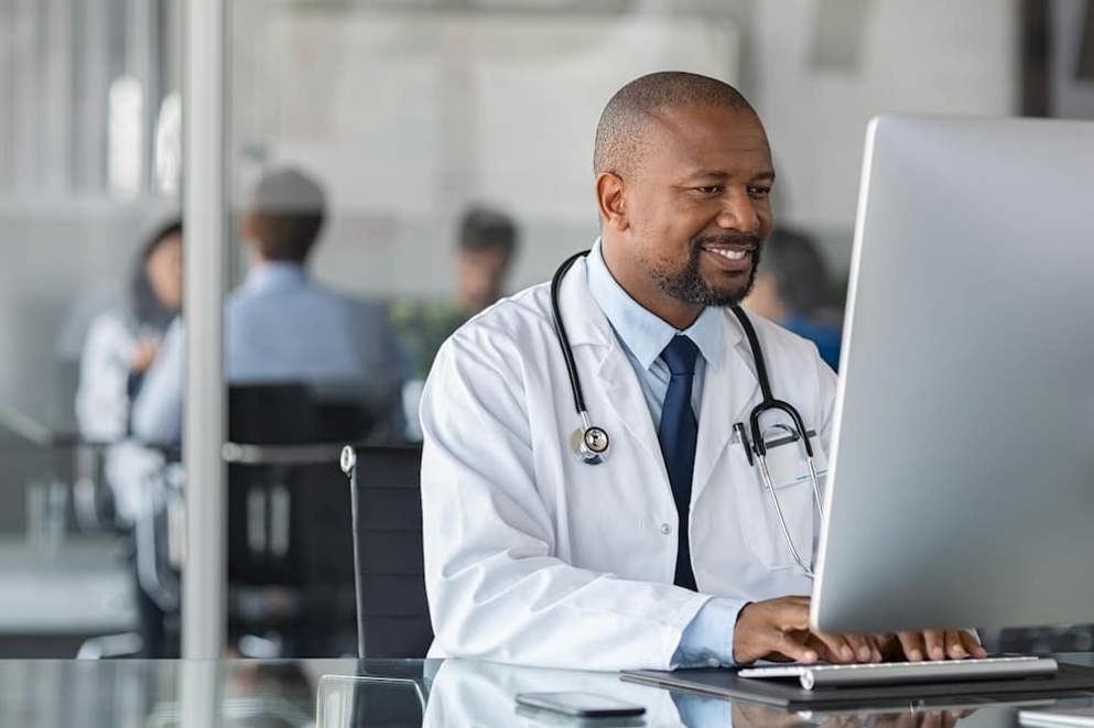 Doctor working on pc