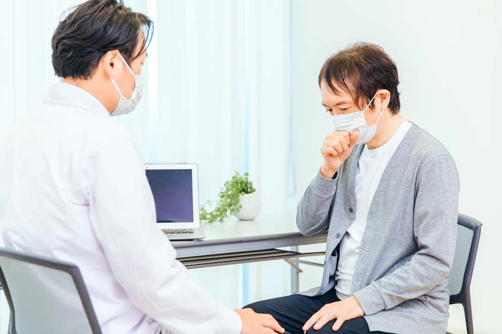 Doctor and patient with masks on