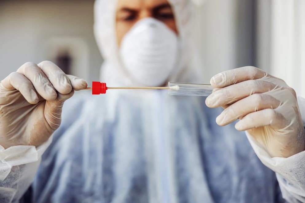 Doctor inspecting a test tube